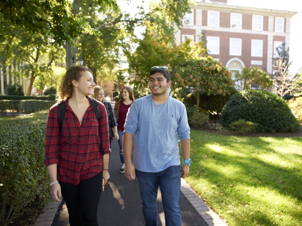 Adelphi students walking on campus right near Blodgett Hall.