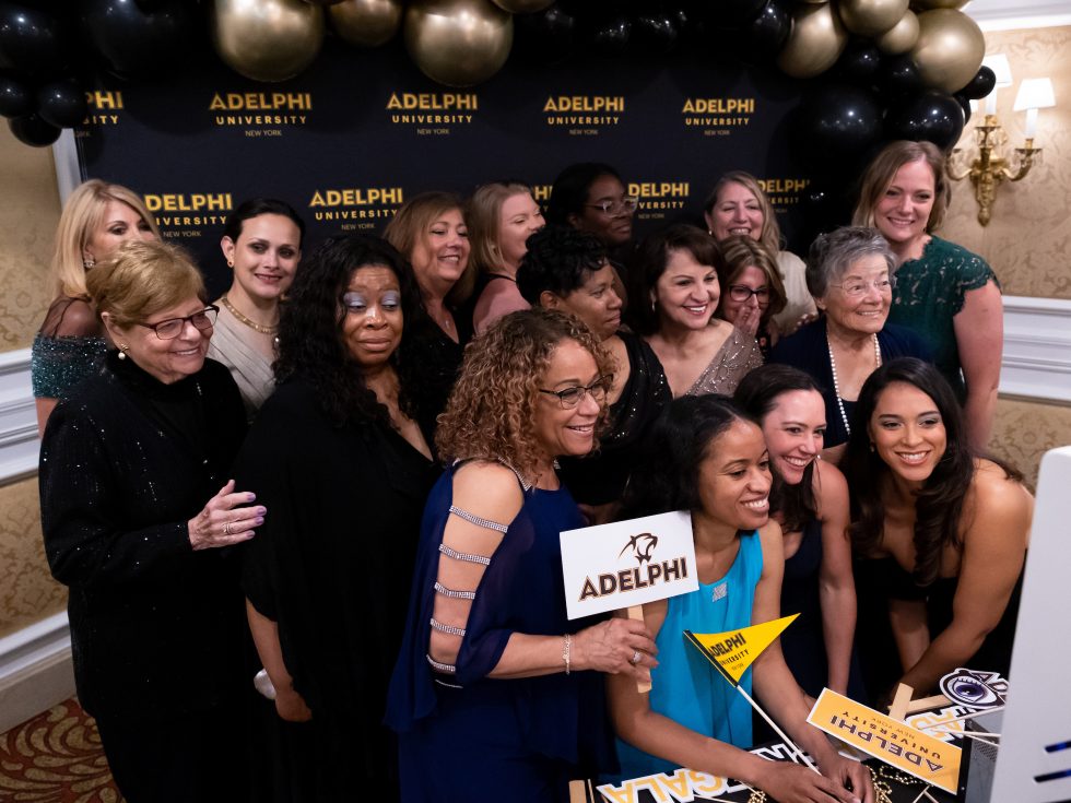 Group of women taking a photo at a gala event